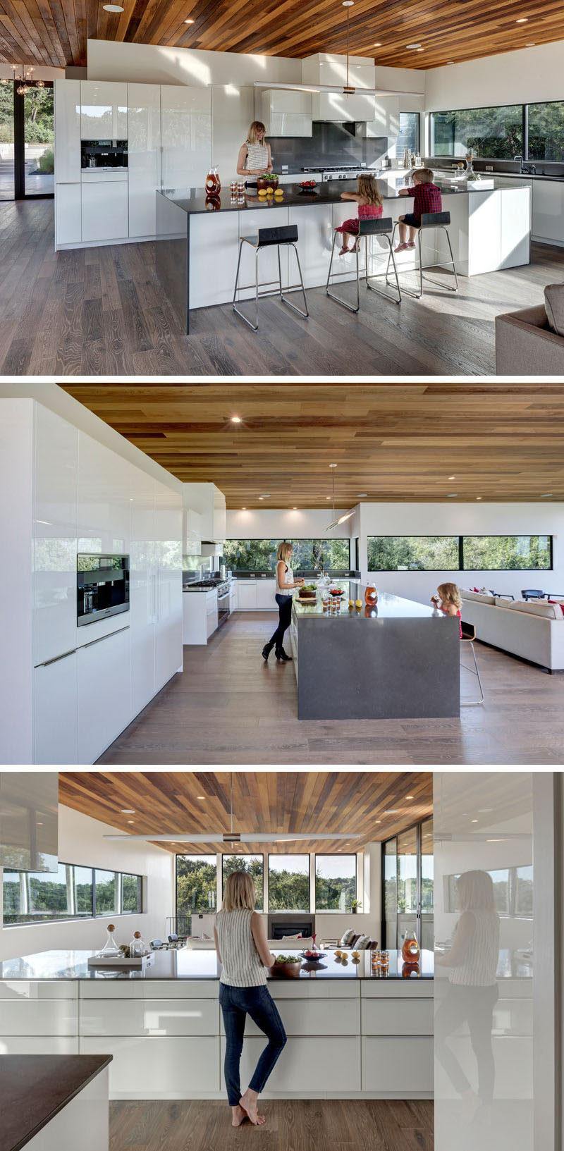 This mostly-all white kitchen is broken up by a dark countertop on the island and backsplash. The kitchen island is large enough to seat multiple people, ideal for entertaining.