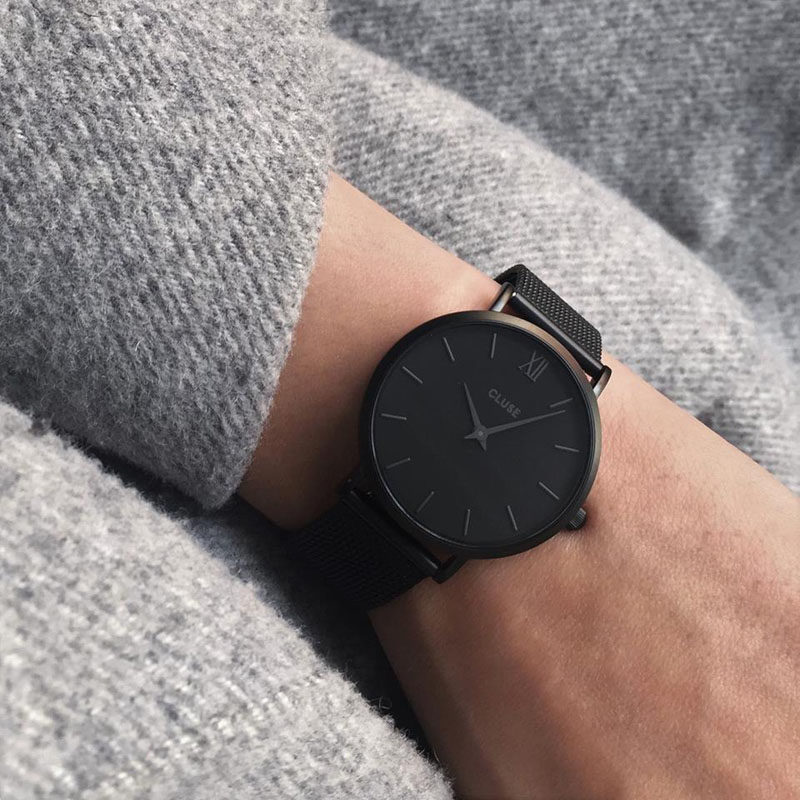 The Ultimate Gift Guide For The Modern Woman (40 Ideas!) // An all black statement watch keeps your girl looking stylish and helps keeps her on time. #ModernWatch #WomensWatch #ModernWomensWatch #GiftIdeas