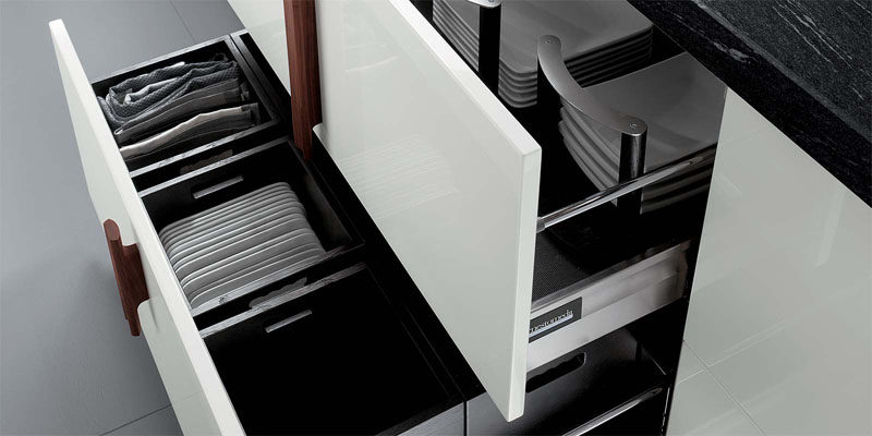 Kitchen Drawer Organization - Design Your Drawers So Everything Has A Place // Non-slip material lines the bottom of the drawers to make sure the plates don't slide around, and dividers ensure that the plates stay where they're supposed to.