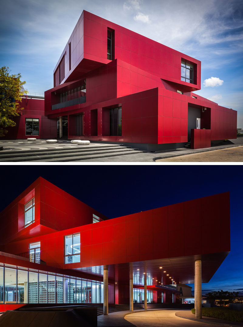 11 Red Houses And Buildings That Aren't Afraid To Make A Statement // This bright red building was built to hold a central kitchen for a restaurant group in Thailand.