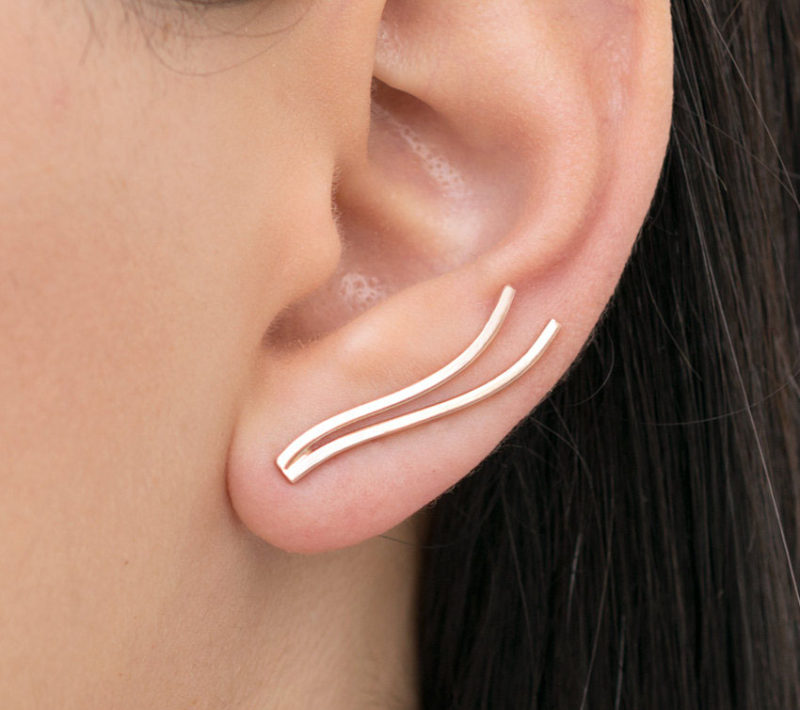 The Ultimate Gift Guide For The Modern Woman (40 Ideas!) // Ear climbers are a gift for girls who want a bit of a different look. These earrings fake the look of having multiple piercings when turned up but can also look like simple drop earrings when flipped down. #ModernEarrings #MinimalistEarrings