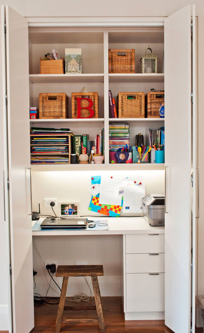 Small Apartment Design Ideas - Create A Home Office In A Closet // This closet acts as the family command center, keeping the phone, printer, books, computer, and other essentials in one convenient place that can be completely hidden in a matter of seconds.