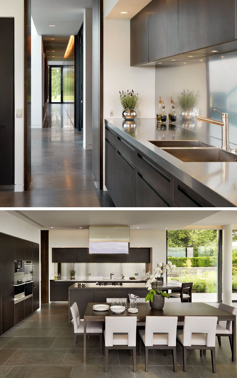 Kitchen Design Idea - Stainless Steel Backsplash // A single strip of shiny stainless steel lines the backsplash of this kitchen to match the countertops and kitchen appliances.