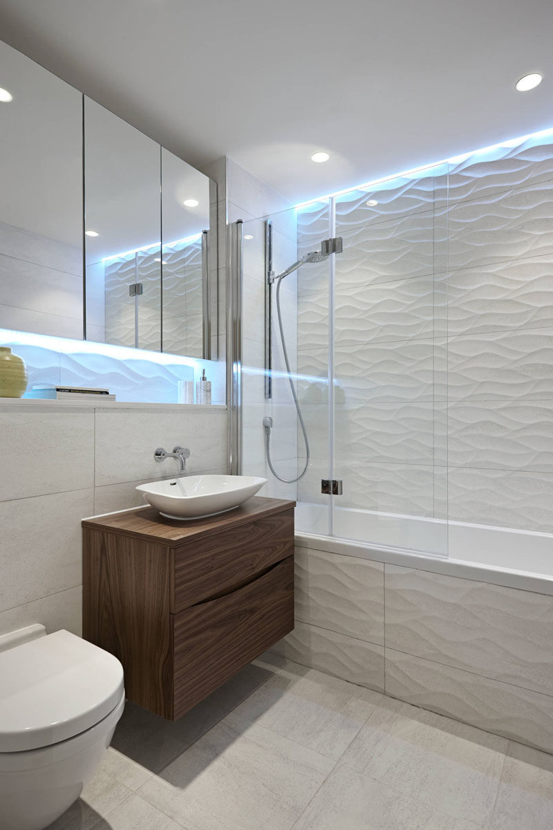 Bathroom Tile Ideas - Install 3D Tiles To Add Texture To Your Bathroom // The cool lights above the wavy tiles make this bathroom look like it's living under water.