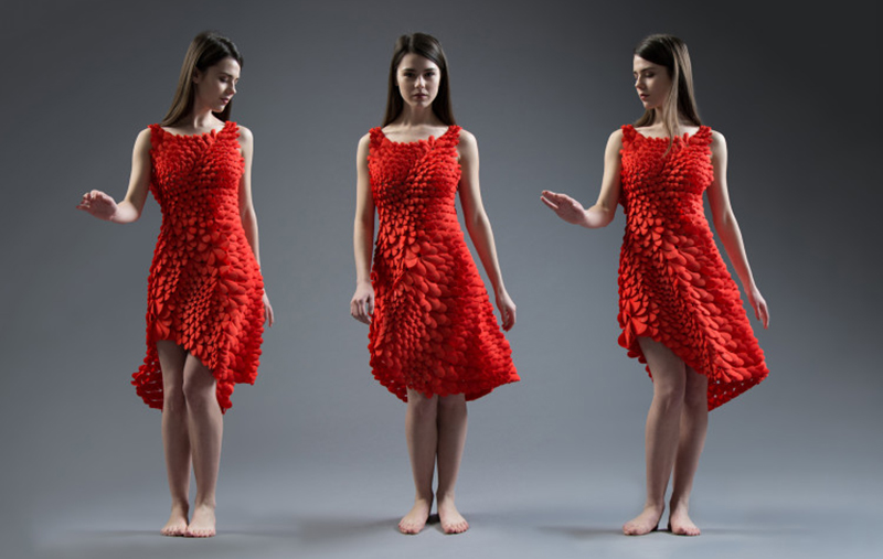 This 3D printed flowing red dress was inspired by petals, feathers, and