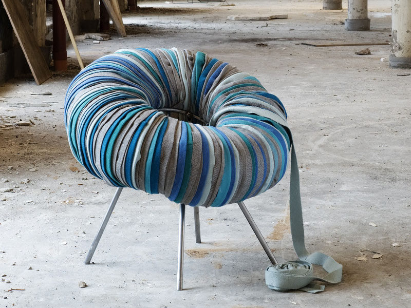 Furniture Ideas - 28 Accent Chairs For A Dramatic Living Room // Strips of fabric cover an inner tube that’s been attached to the metal base to create a textured chair.