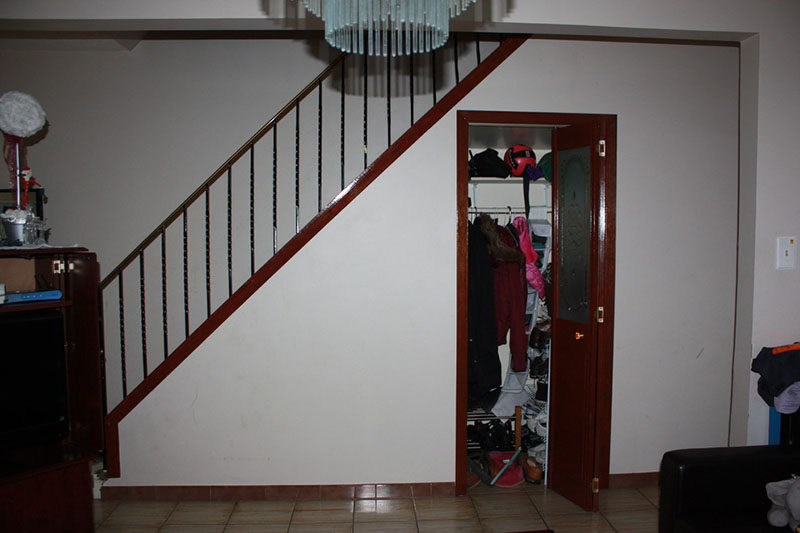 This home was renovated to have bright white interiors, under stair storage and a dedicated coffee station.