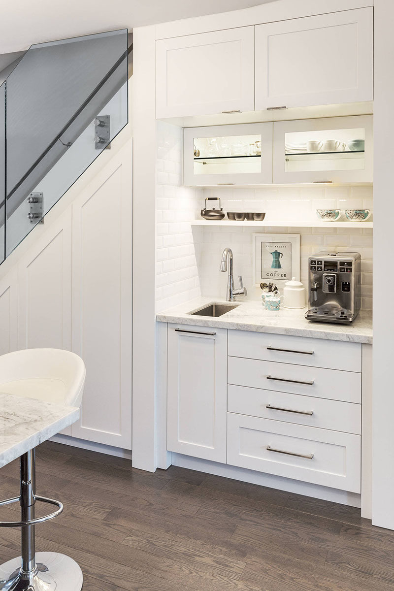 This home added a coffee station and food storage cabinet under the stairs