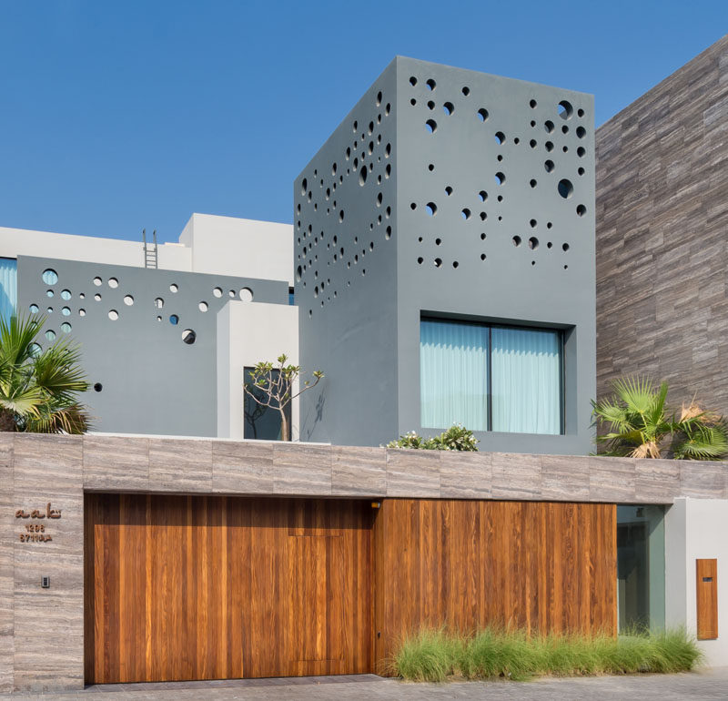 Circular details and wooden elements area featured throughout this home. #ModernArchitecture