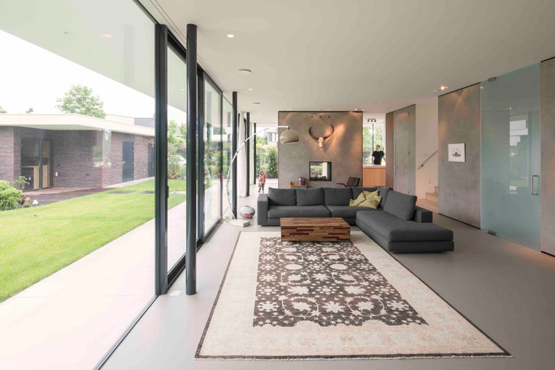 In this living room, the large glass doors slide open to create indoor/outdoor living spaces.