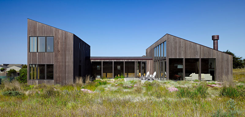 Malcolm Davis Architecture have designed a contemporary wooden home in California, that features a calm and relaxing interior with large windows.