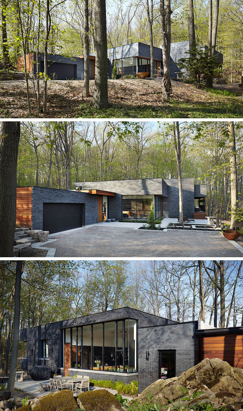 18 Modern House In The Forest // The contrast between the black brick and wood panels on this forest home make it stand out in the lush forest around it. #ModernHouse #ModernArchitecture #HouseInForest #HouseDesign