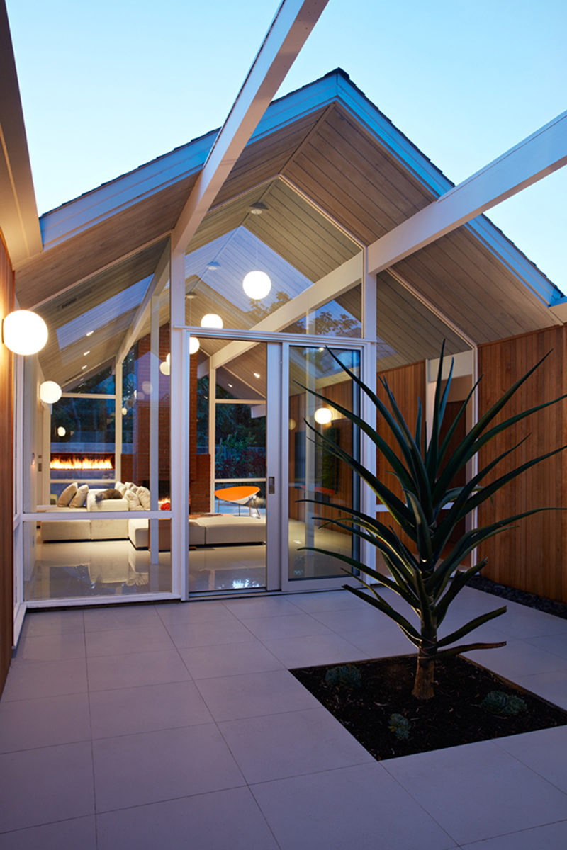 This remodeled mid century modern house in California has a courtyard before you reach the main living area.