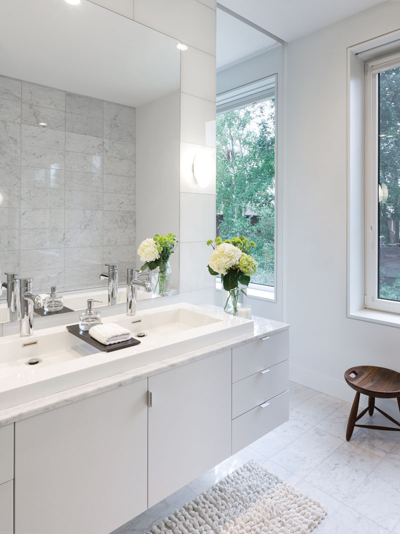 Bathroom Design Idea - Extra Large Sinks Or Trough Sinks (20 Pictures) // This long sink has a wood divider on top of it that lets water flow underneath it and provides an extra spot to store a few small items.