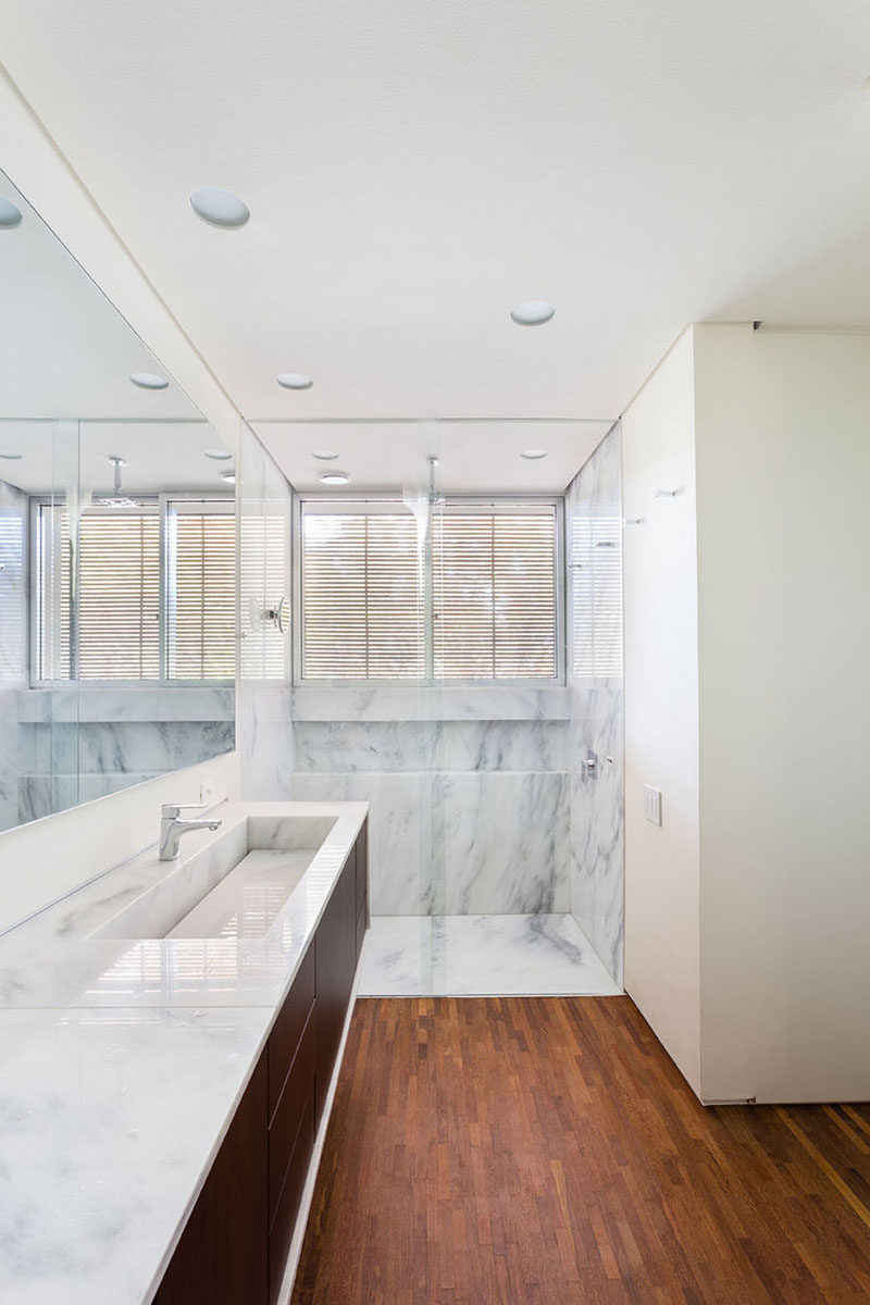 Bathroom Design Idea - Extra Large Sinks Or Trough Sinks (20 Pictures) // This marble trough sink matches both the countertops and the shower creating a sophisticated and unified look.