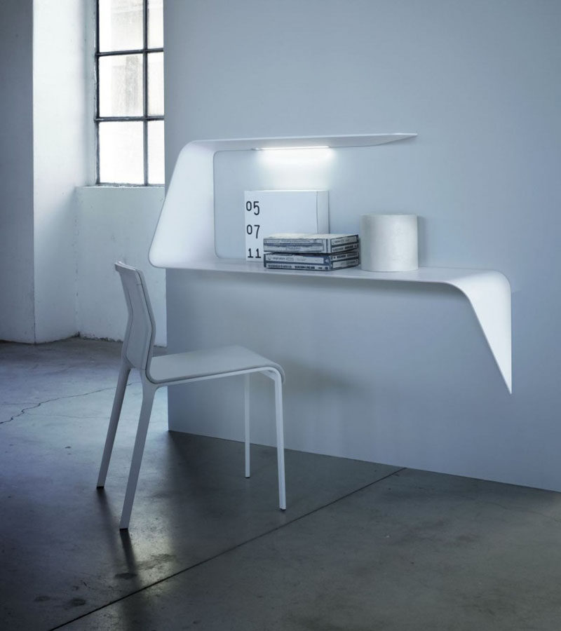 This curved floating shelf also doubles as a desk.