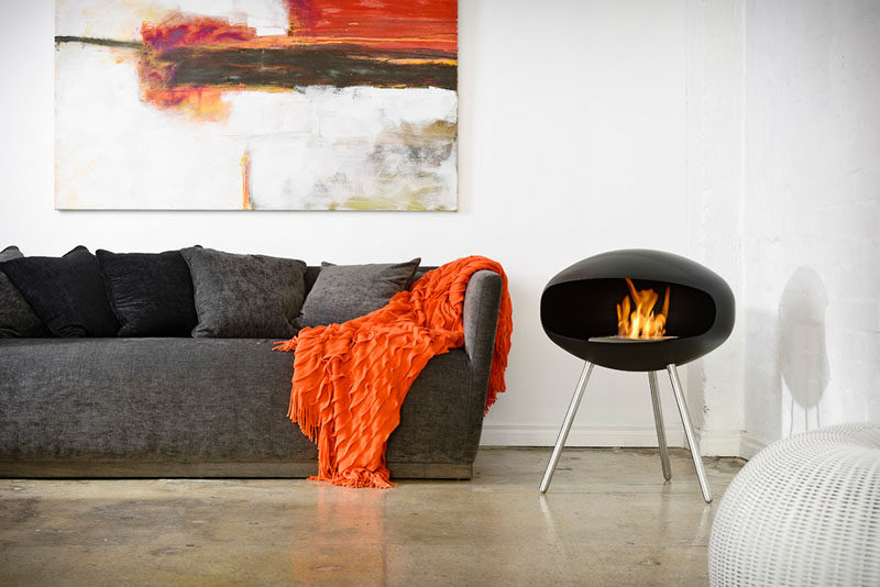 Warm Up Your Life With These 13 Freestanding Fireplace Designs // This simple and modern freestanding fireplace is the perfect size for heating a small room and burns cleanly so you can feel good about having it indoors.