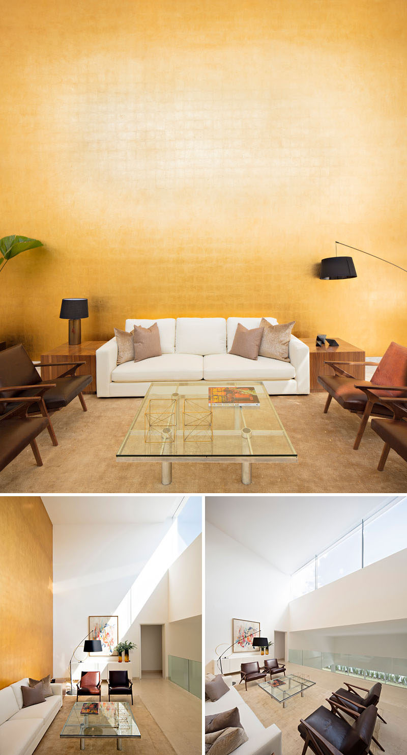 In this house, there's a reading area that has a wall covered in gold sheet that's a tribute to artist Mathias Goeritz. When the sun is shining, the gold reflects the glow into the main floor of the home.