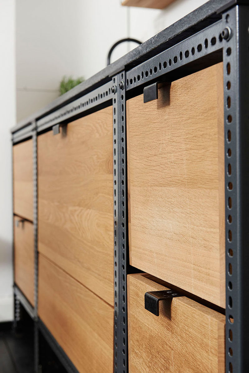 Interior Design Details - Industrial Close Ups // Light wood crates contrast the dark metal frame and pull tabs on this small industrial kitchen unit.