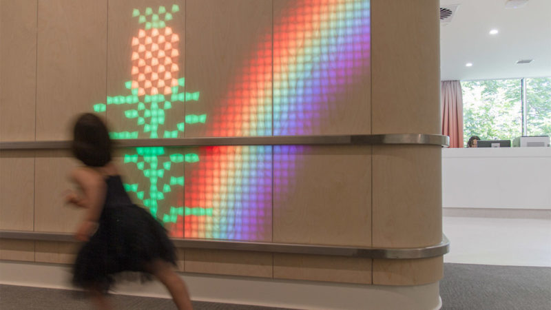 This Children's Hospital Has A Fun Wooden Wall Filled With Moving Lights