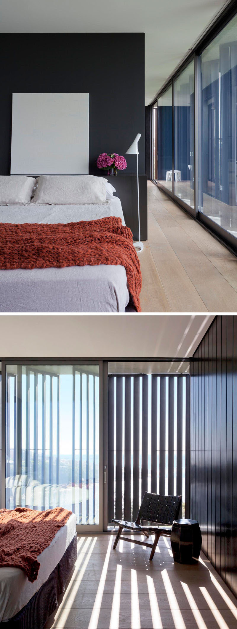 In this master bedroom, a black feature wall creates a dramatic backdrop for the bed, and large sliding glass doors let the breeze flow through the room.