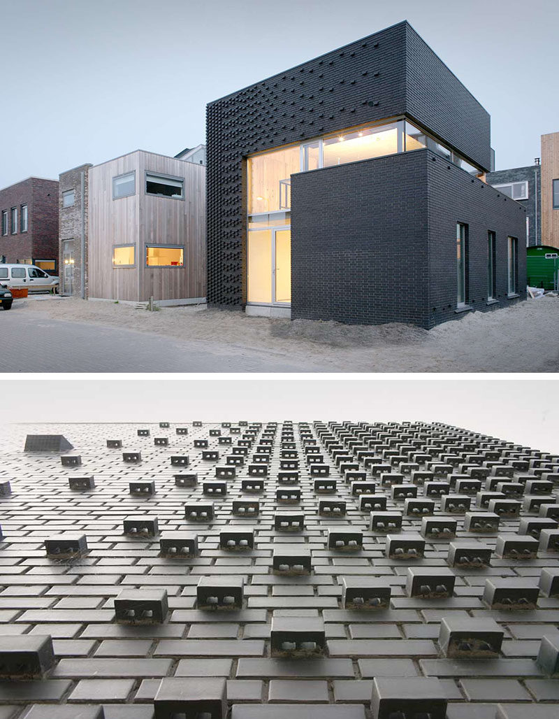 Dark bricks on the exterior of this house and their unique arrangement keep the building smooth in some places and textured in others.