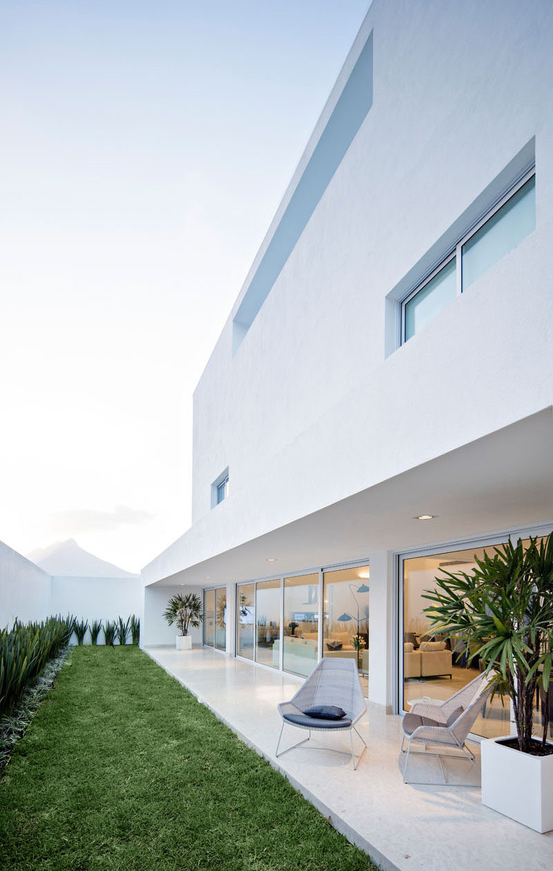 Just off the living areas of this home is a linear backyard that runs the length of the house. A covered patio area provides space to relax in the shade.