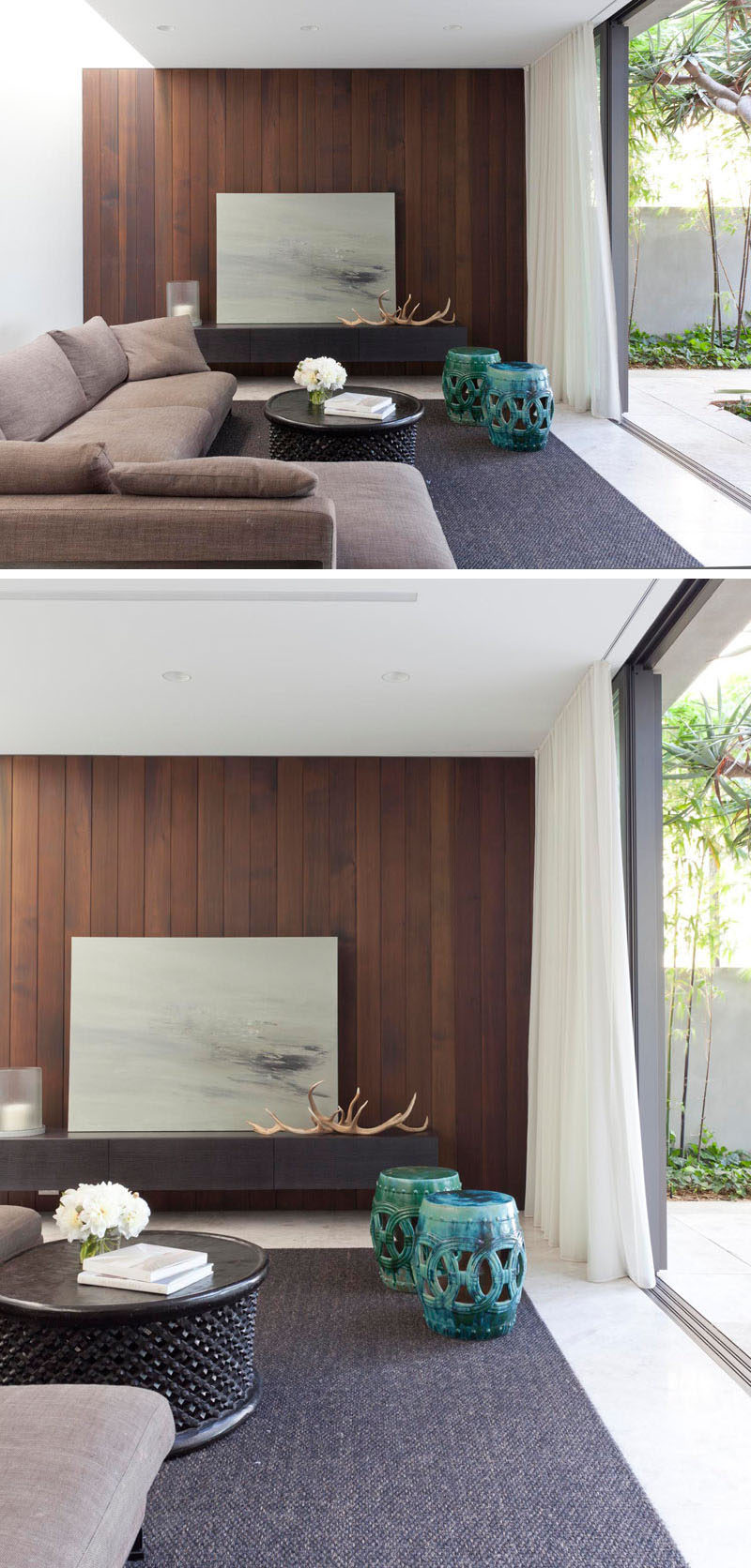 This living area has a dark timber feature wall and siding glass doors that open up onto a private courtyard.