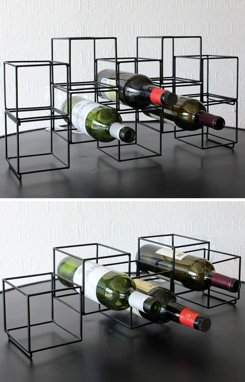 13 Wine Bottle Storage Ideas For Your Stylish Home // A single one of these matte black geometric wine racks lets you store 5 bottles of your favorite wine, but stack more of the holders on top of each other and you can store as much wine as you like.