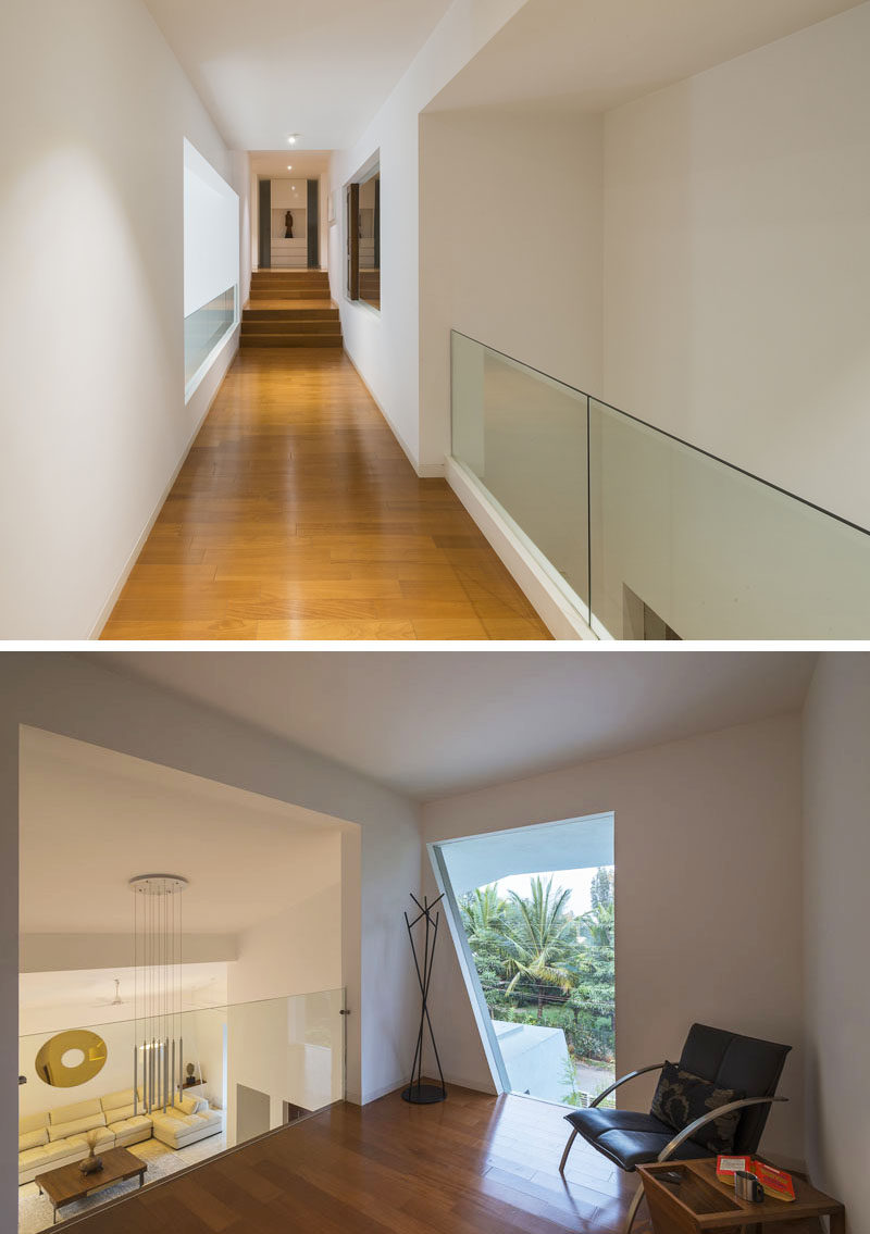 This small sitting area at the end of a hallway overlooks the living room below.