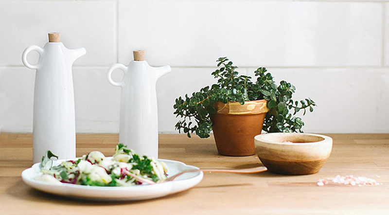 Essential Kitchen Tools - 11 Creative Oil & Vinegar Dispensers // White ceramic oil and vinegar cruets make it easy to drizzle just the right amount of oil over salads or onto dishes being prepped.