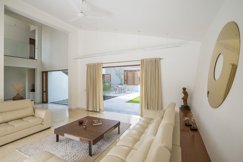 This living room has direct access to the backyard and water feature.