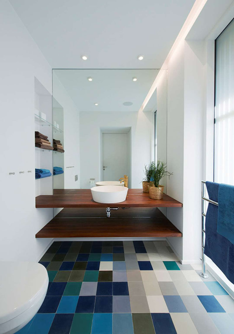 Bathroom Design Ideas - Open Shelf Below The Countertop // The wood counter and shelf in this bathroom add warmth to the colorful space and provide a convenient place to store all your bathroom essentials.