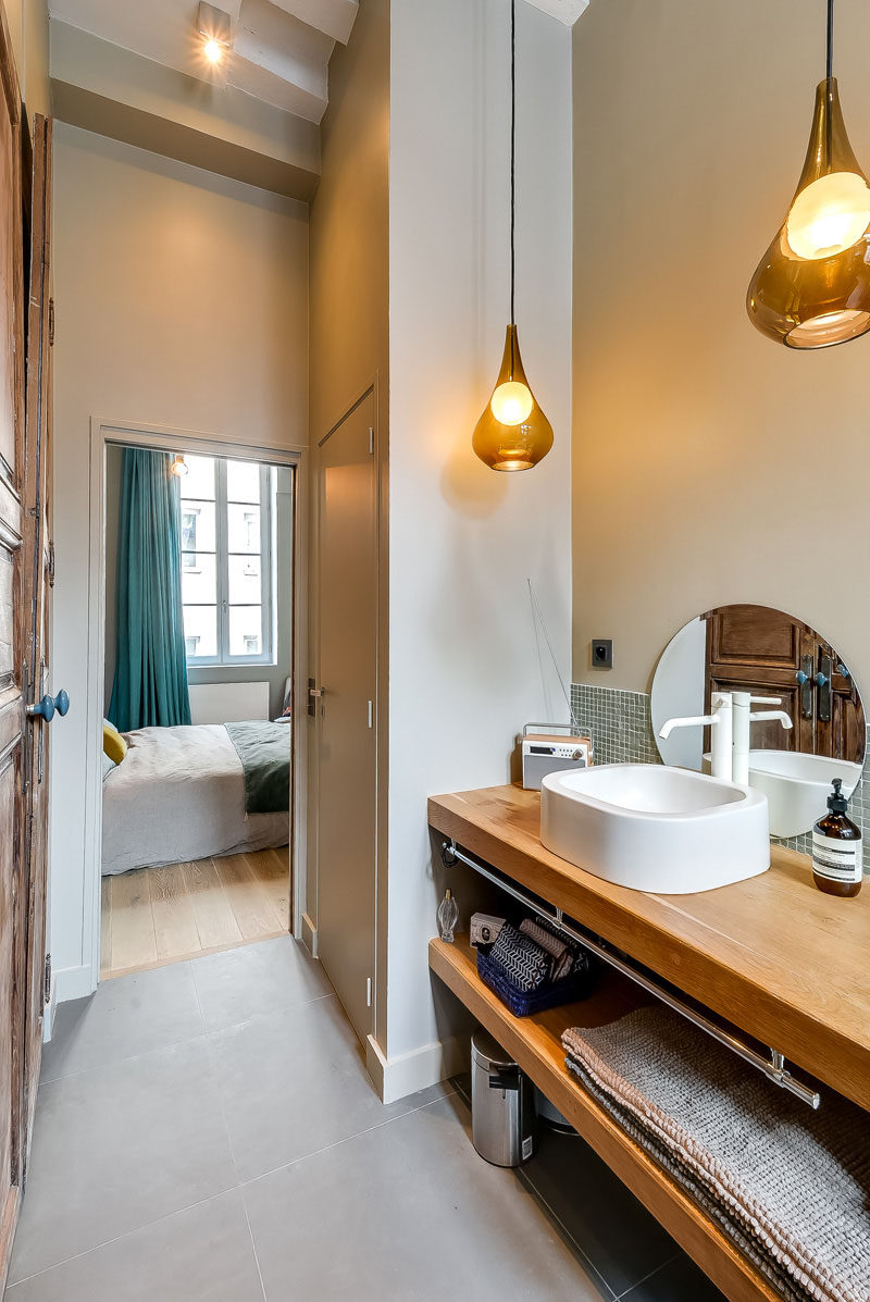 Bathroom Design Ideas - Open Shelf Below The Countertop // There's enough space under this bathroom shelf to fit a small garbage can and maybe even a few baskets with toilet paper or other bathroom essentials.