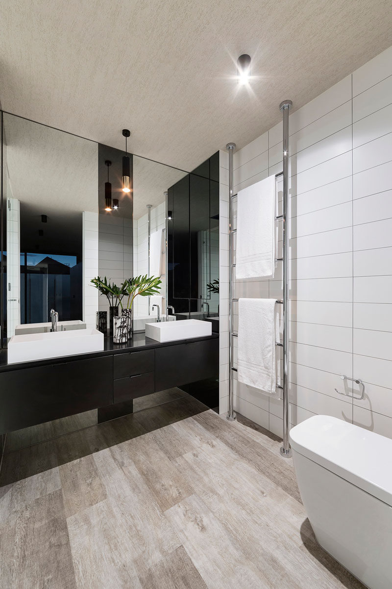 5 Bathroom Mirror Ideas For A Double Vanity // Two rectangular mirrors adds height to the bathroom and lets each person have their own space.