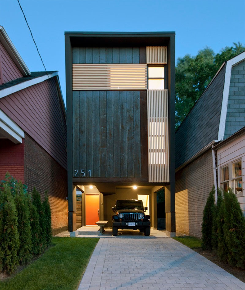 11 Small Modern House Designs // This narrow house fits tightly between the two houses on either side of it and makes up for it's narrow width by being slightly taller than the other houses around it. #SmallHouse #ModernHouse #ModernArchitecture #SmallHome