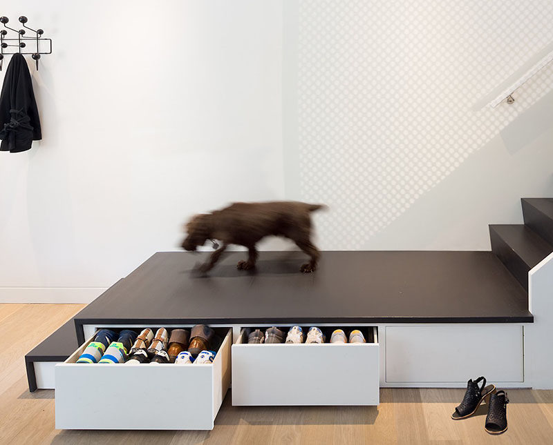 Stairs Design Ideas - This home has three hidden drawers located under the stair landing that are perfect for storing shoes and dog toys.