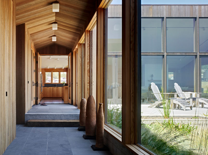 Wood, glass and stone make up the palette in this hallway.