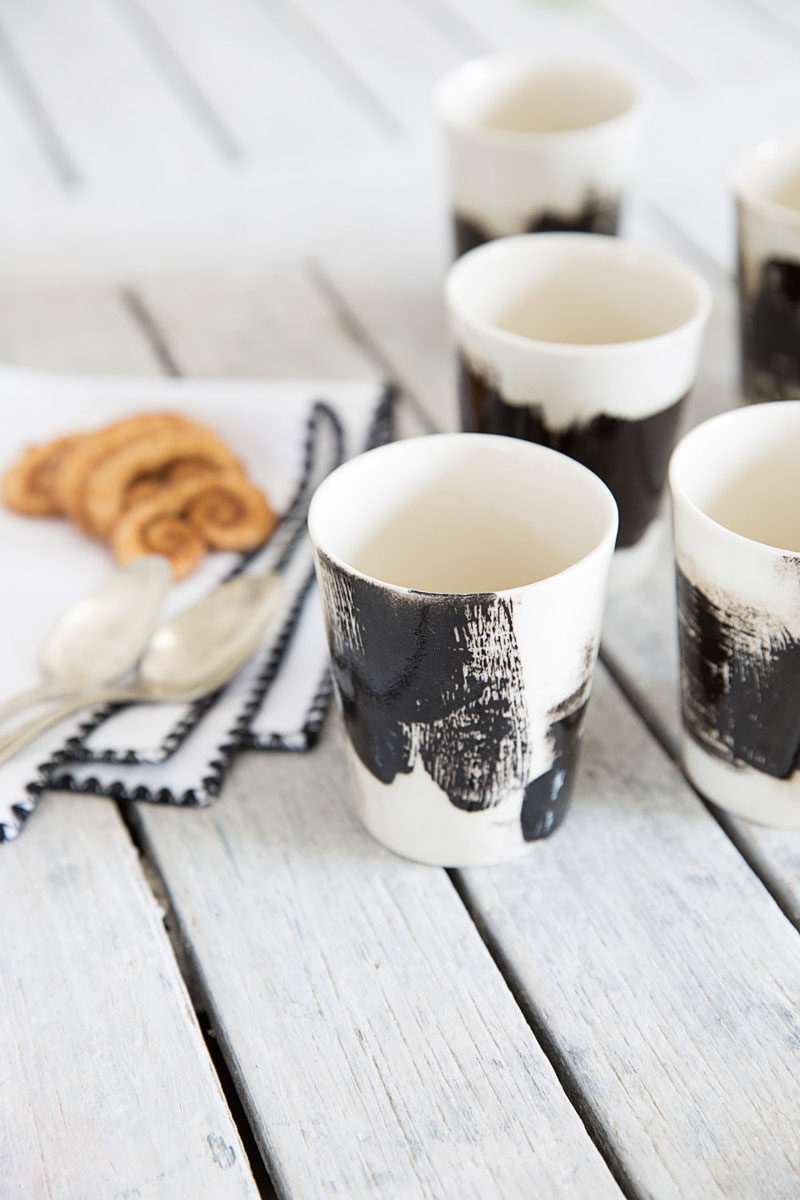 Mini black and white ceramic espresso cups.