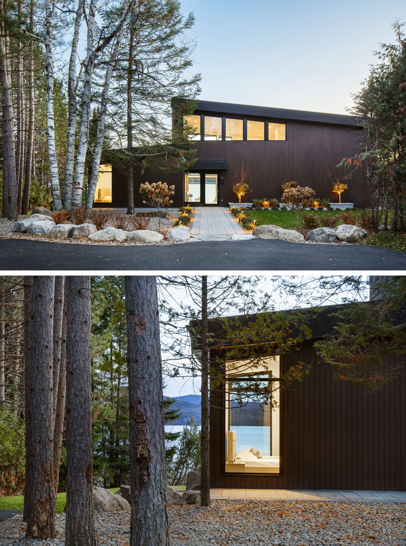 This modern lake house in Canada has an exterior clad in wood, stone, and metal