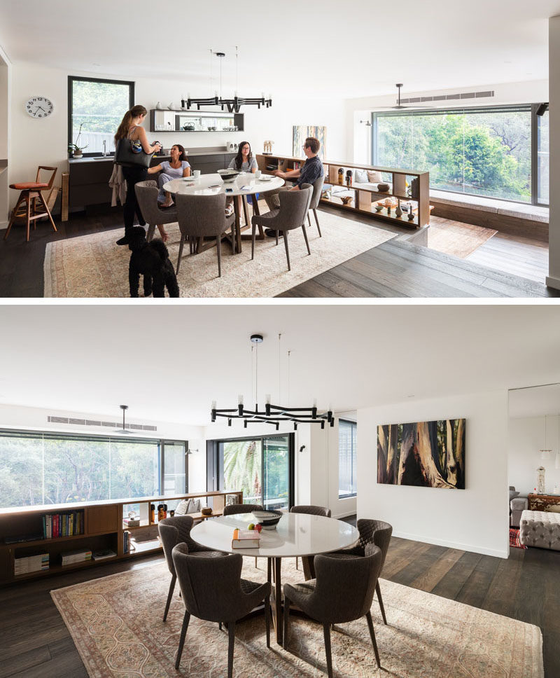 Stepped up from the living room is the dining and kitchen area. A small bookshelf provides a safety barrier between the dining space and the living room.