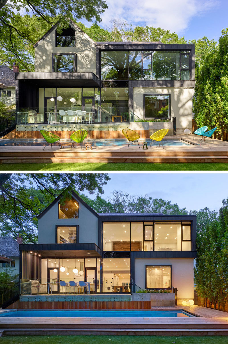 The rear of this home received a contemporary extension with large floor-to-ceiling windows positioned to frame trees the in the backyard.