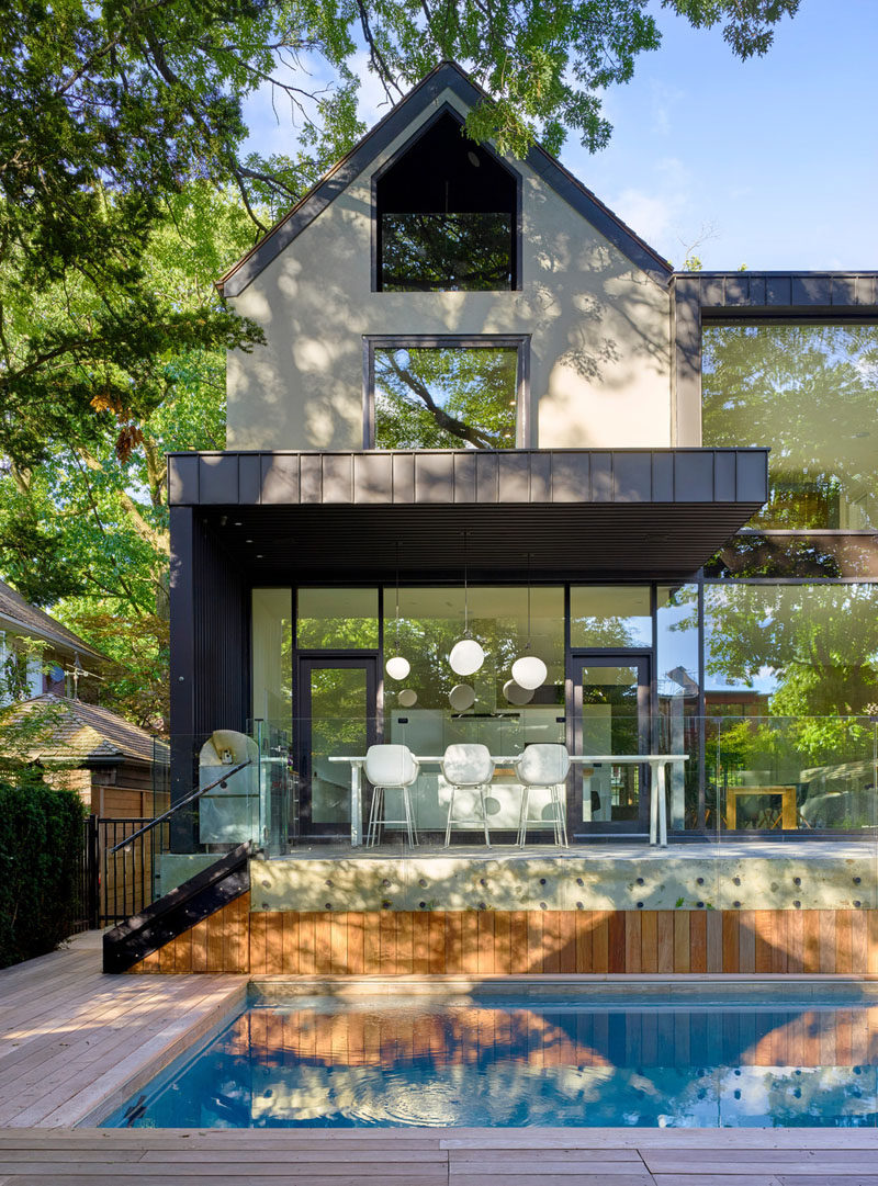 A peaked gable end on this renovated house pays homage to the architecture of other homes in the neighborhood.