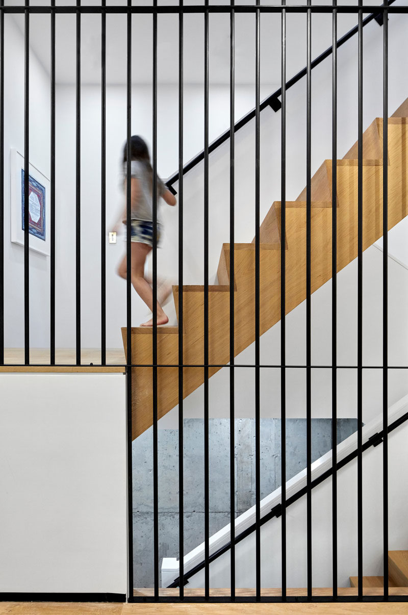 Steel, concrete, wood and white have been combined to create a contemporary staircase