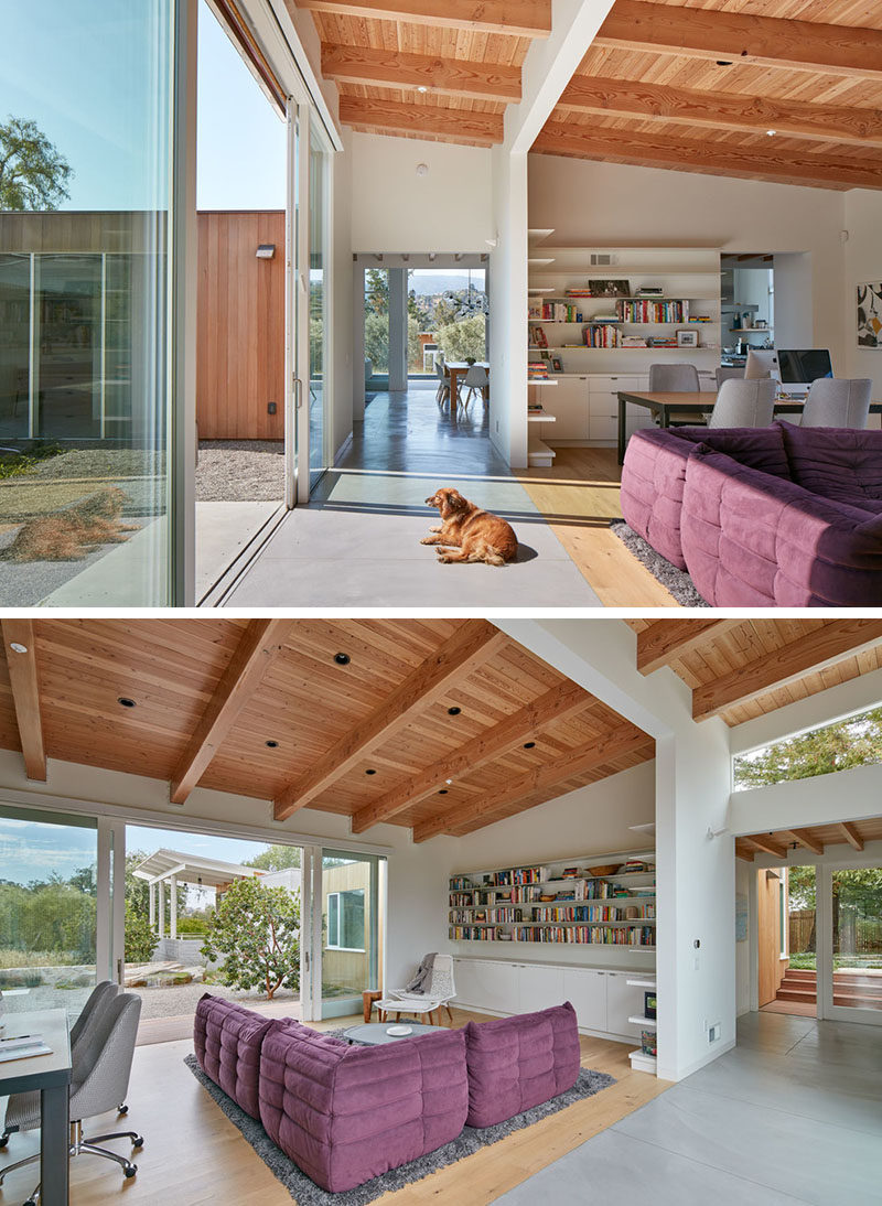 This family room has a Douglas fir ceiling, a comfortable 'L' shaped couch and a small office area. It also opens up to the outdoors.