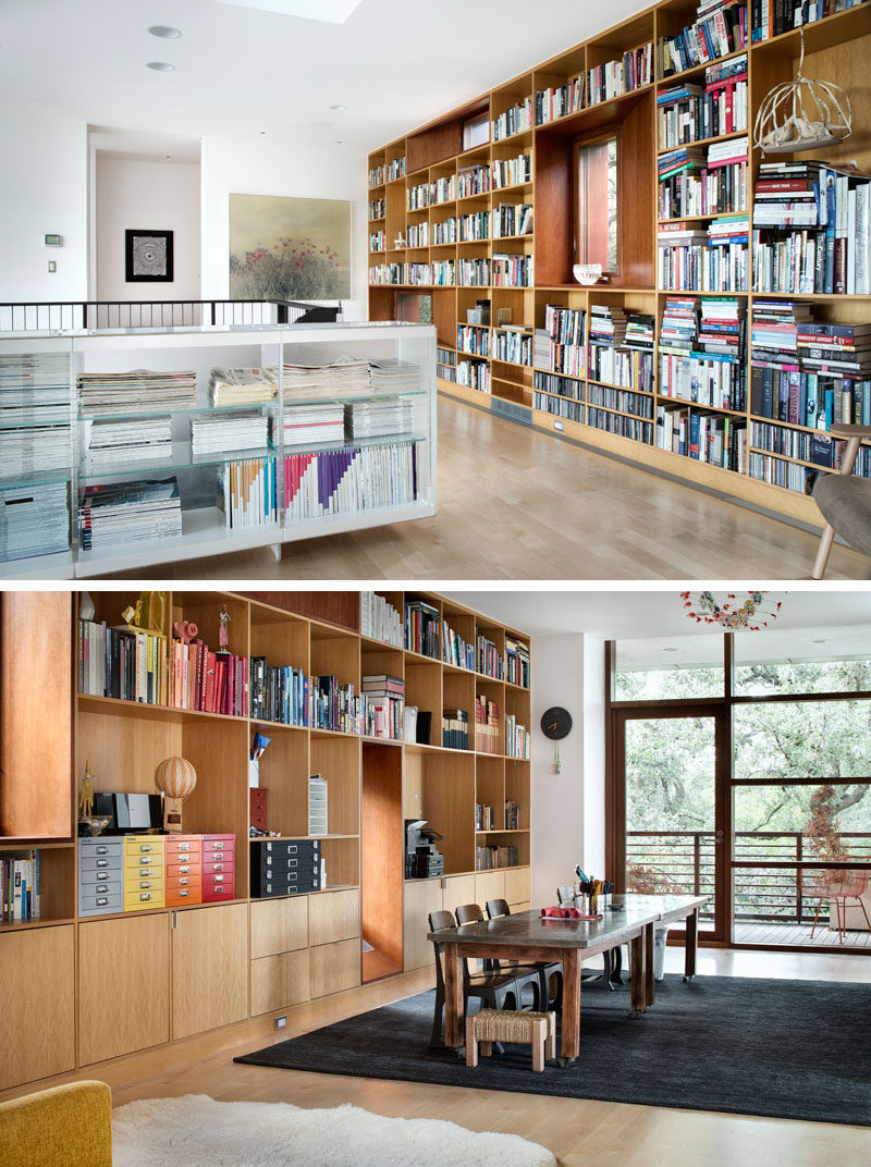 This contemporary home has a library with floor-to-ceiling built-in bookcases.