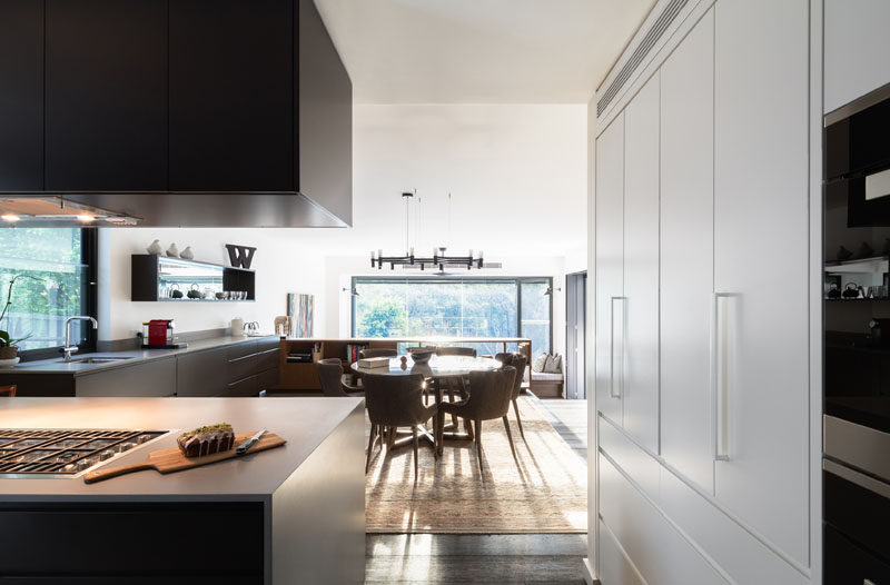 This small dining space with round dining table is surrounded by the kitchen.