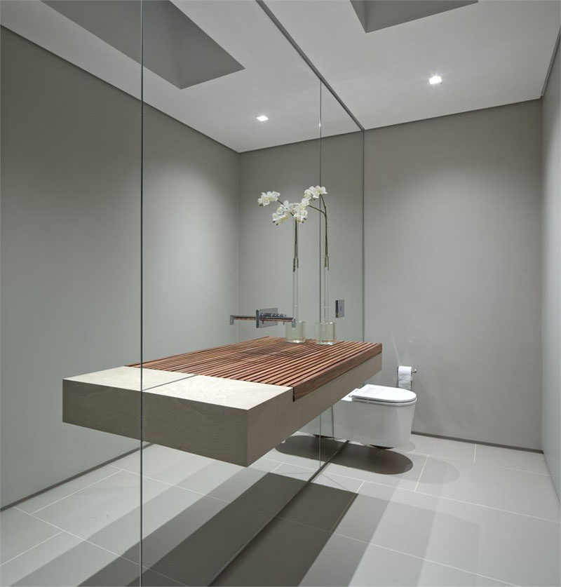 This wall of mirror makes the small bathroom seem much larger than it actually is and makes the sink appear to be a lot wider than it really is.