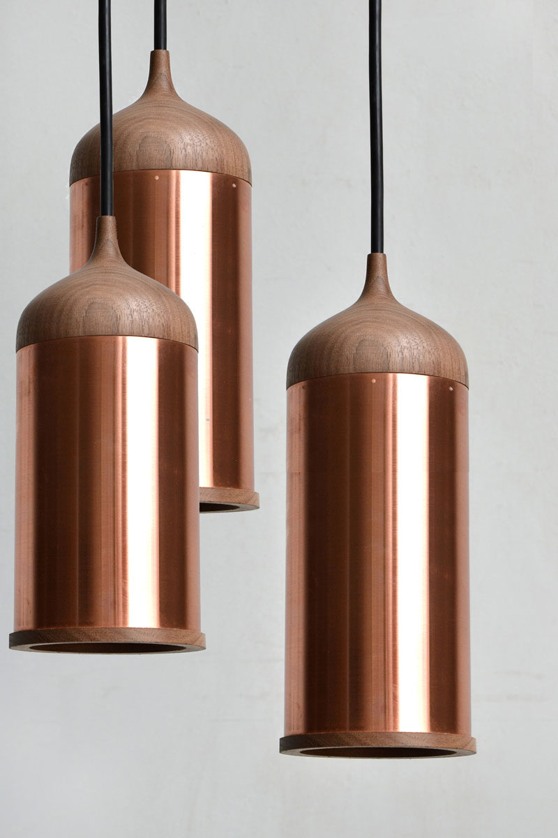 Kitchen Decor Ideas - 12 Ways To Add Copper To Your Kitchen // Hang copper pendant lights above your kitchen island to provide additional light to your food prep area.