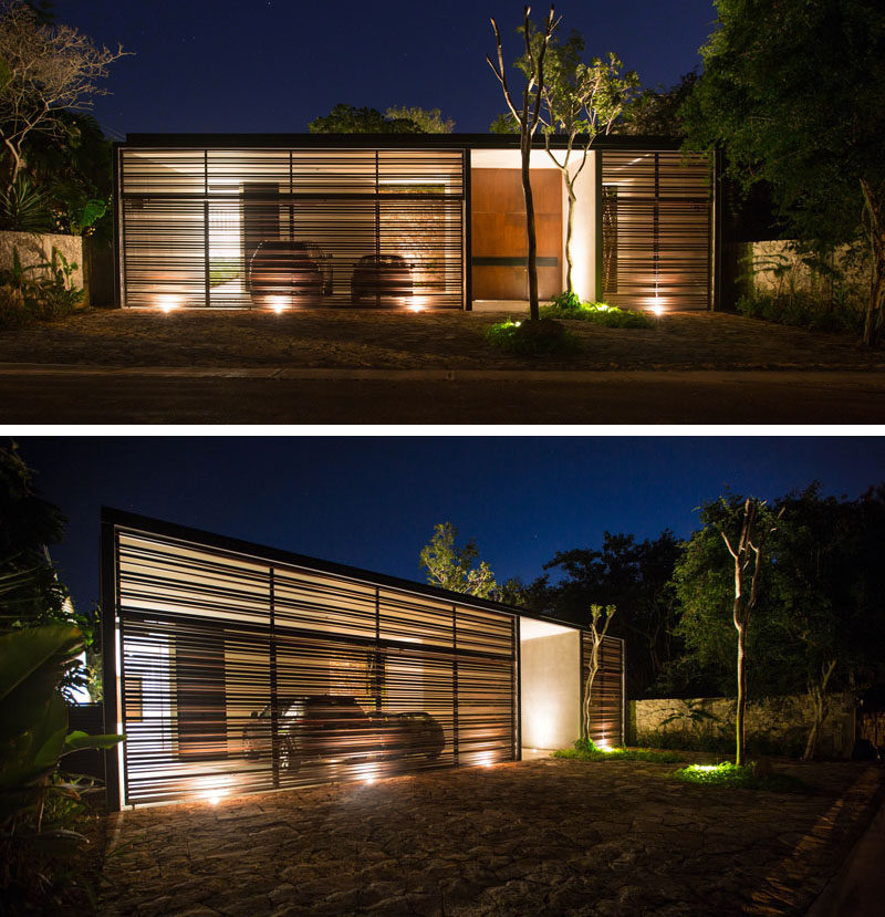 Upon arriving at this 2 bedroom house, you are greeted by the garage which is lit up enabling you to see the cars within.